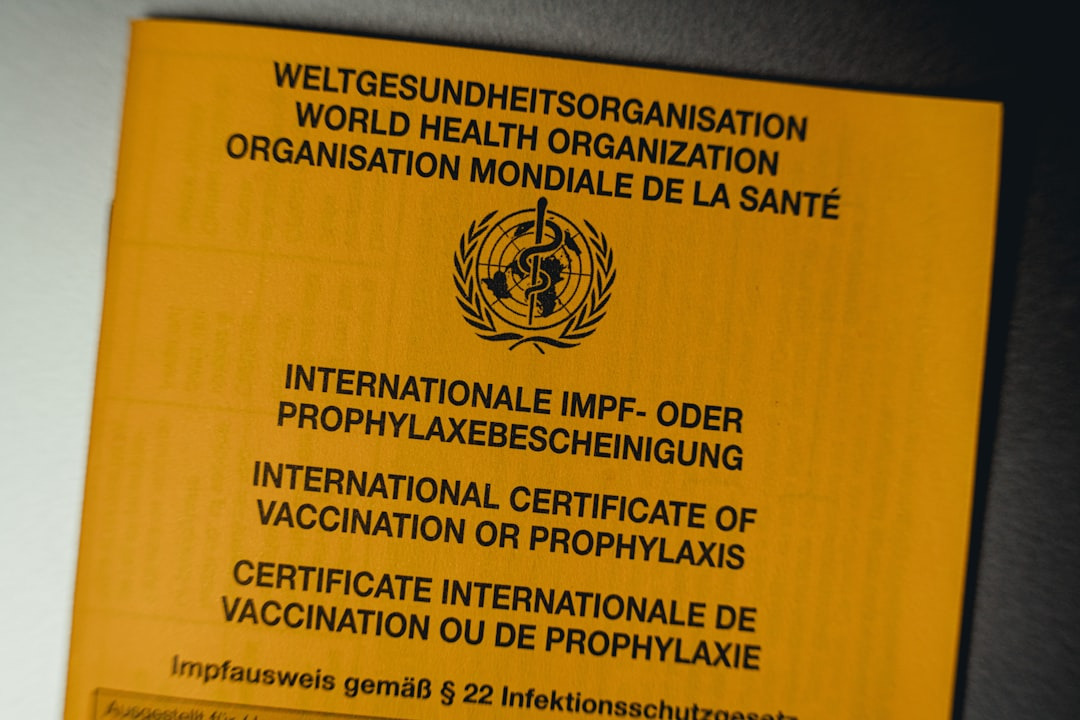 The yellow cover of an International Certificate of Vaccination document.